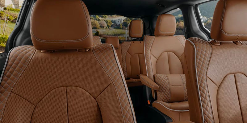 Tan leather interior seats with diamond stitching in a vehicle
