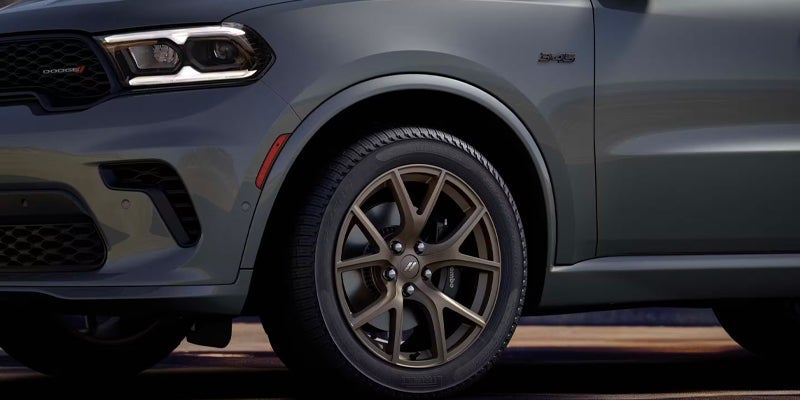 Close-up of a grey Dodge Durango wheel and front quarter panel