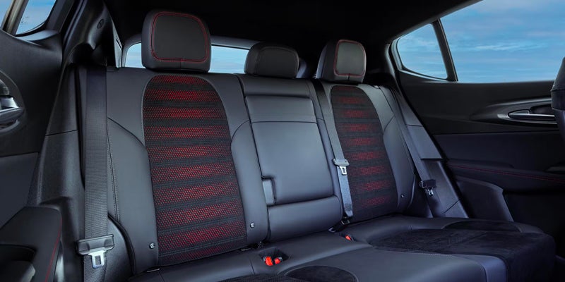 Black leather and red-accented rear seats in a vehicle interior