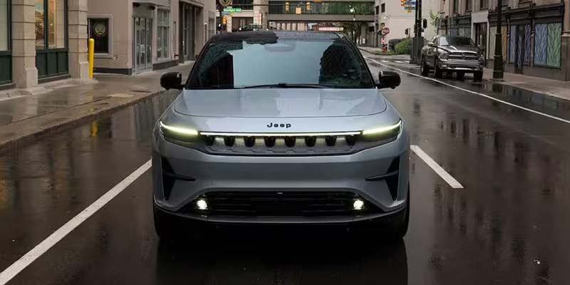 Front view of a silver Jeep Wagoneer S in the rain